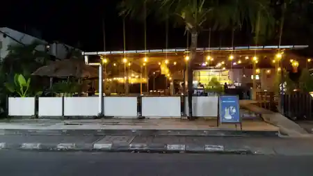 Night exterior with string lights and palm trees at Beach Garden in Bali — salsa, bachata venue in Bali