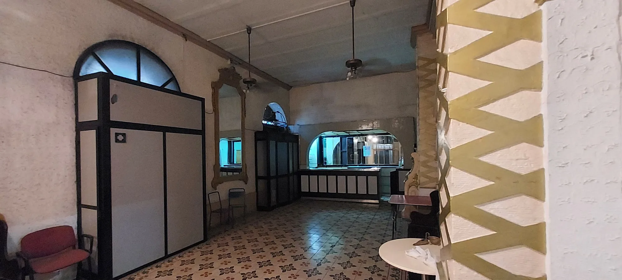 Orpheum Theatre Gżira Malta — interior foyer with tiled floor, bar area and arched windows