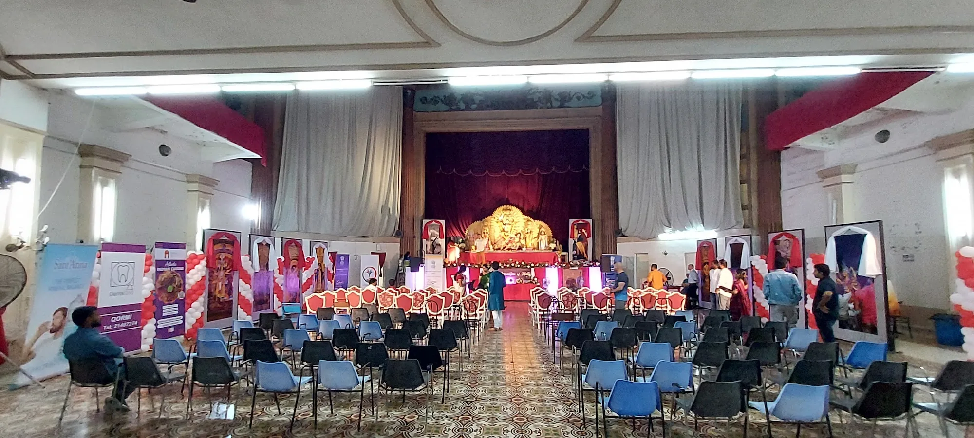 Orpheum Theatre Malta — main hall with proscenium stage and rows of chairs set for an event