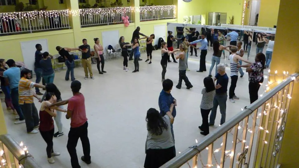 Salsa dancers in partner hold on the dance floor at DanceSport Dupont Circle in Washington