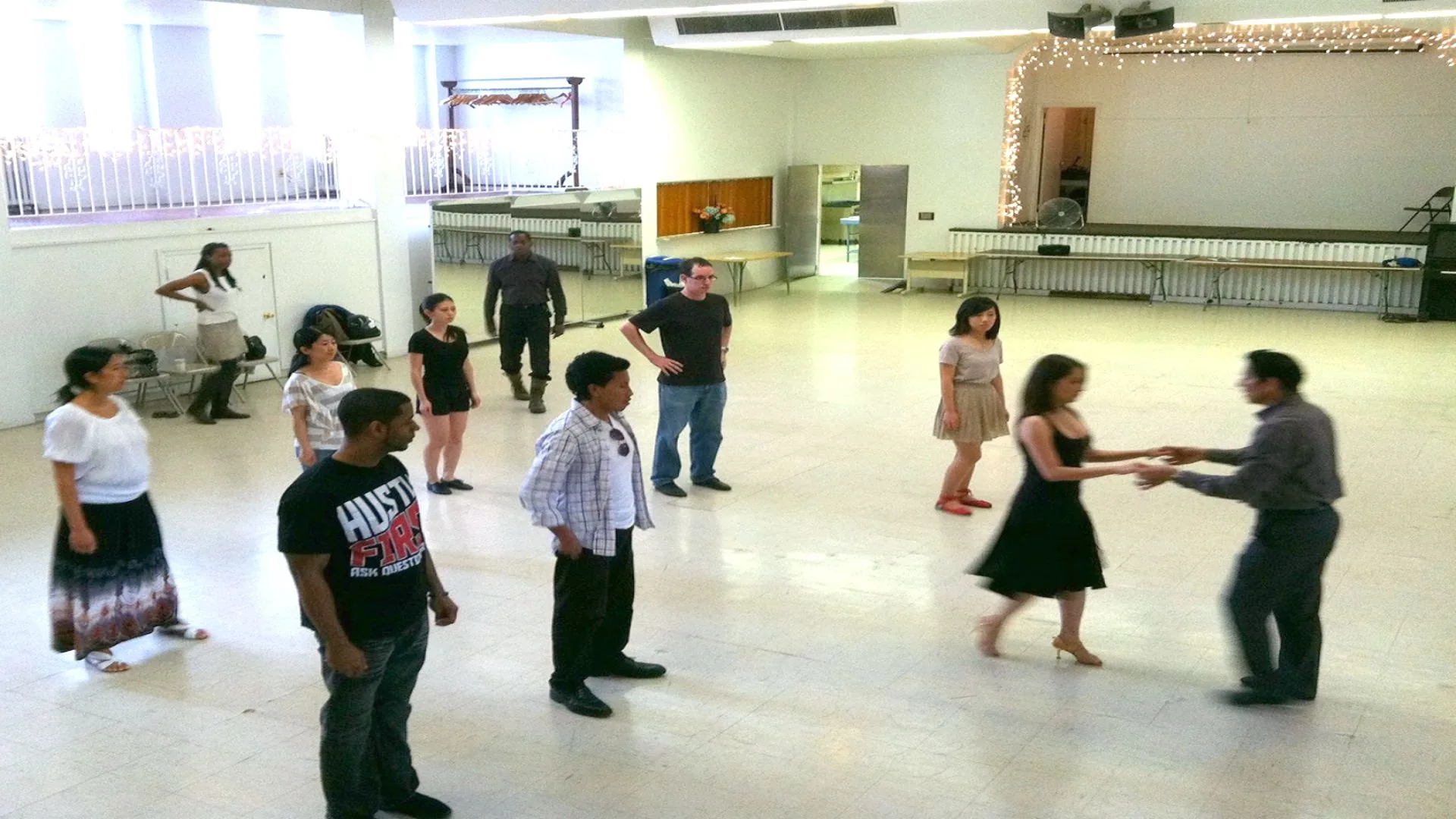 Dancers practicing on the spacious wooden floor at DanceSport Dupont Circle in Washington