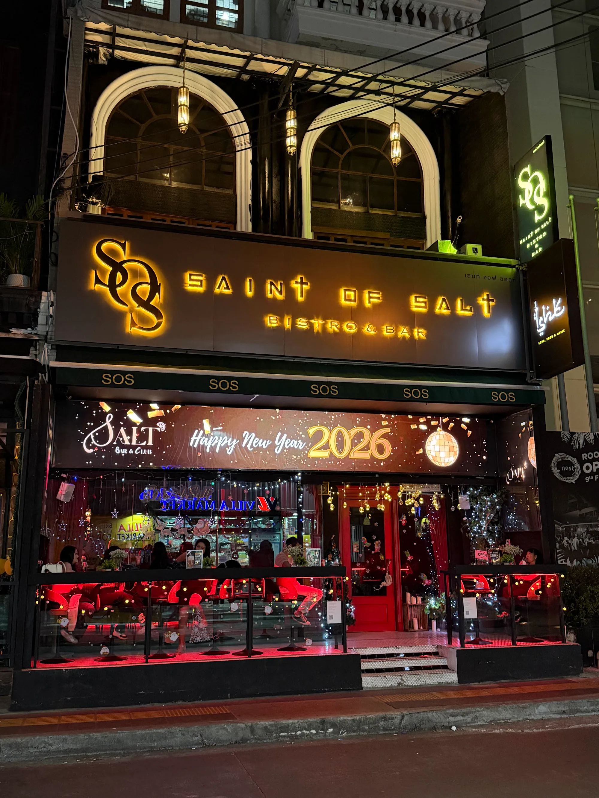 Illuminated Saint of Salt Bistro and Bar exterior signage in Sukhumvit, Bangkok