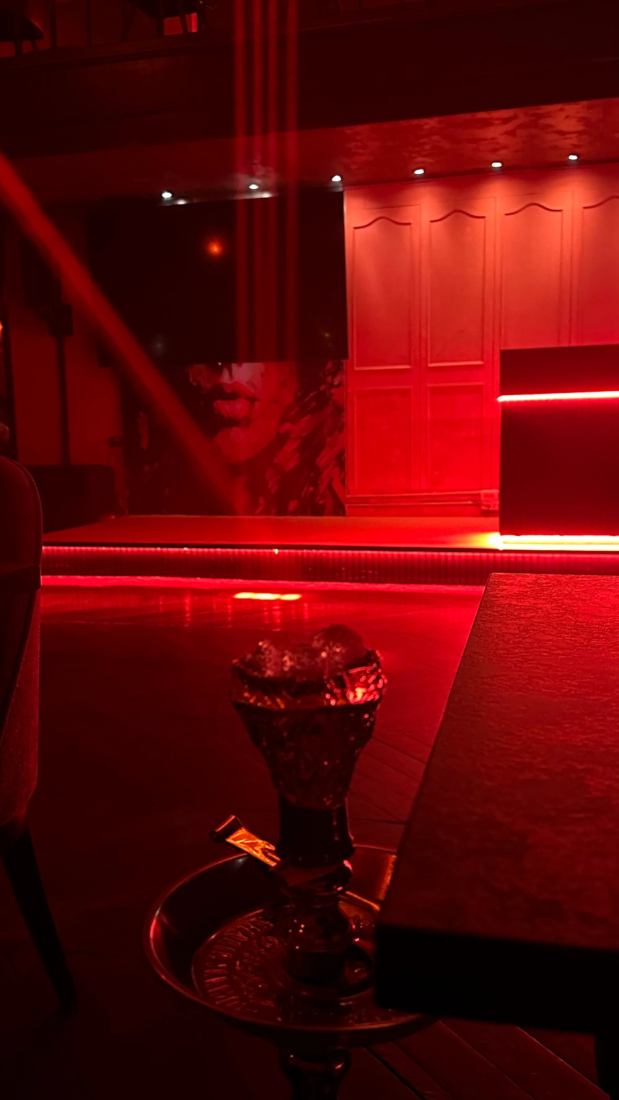 Red-lit stage area inside Saint of Salt Sukhumvit, Bangkok