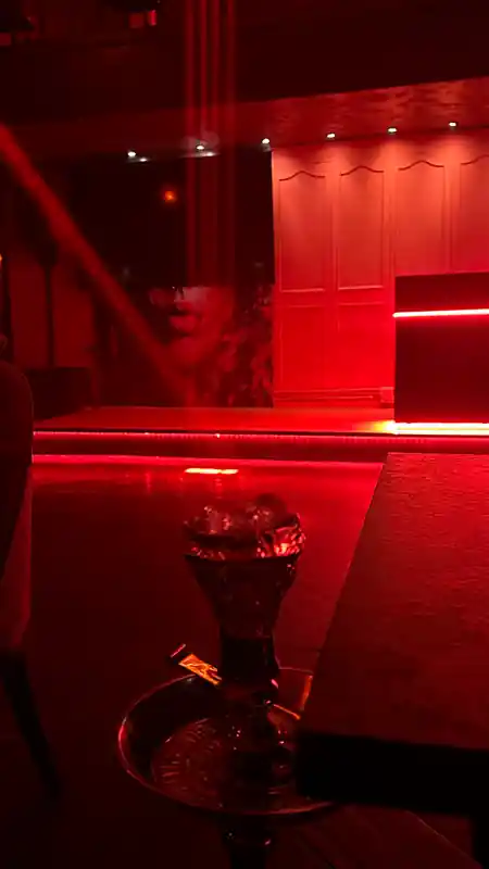 Red-lit stage area inside Saint of Salt Sukhumvit, Bangkok — salsa, bachata, kizomba venue in Bangkok