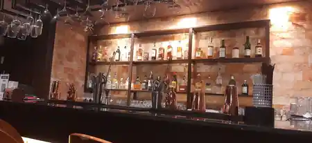 Backlit Himalayan-salt bar shelving at Saint of Salt Sukhumvit, Bangkok — salsa, bachata, kizomba venue in Bangkok