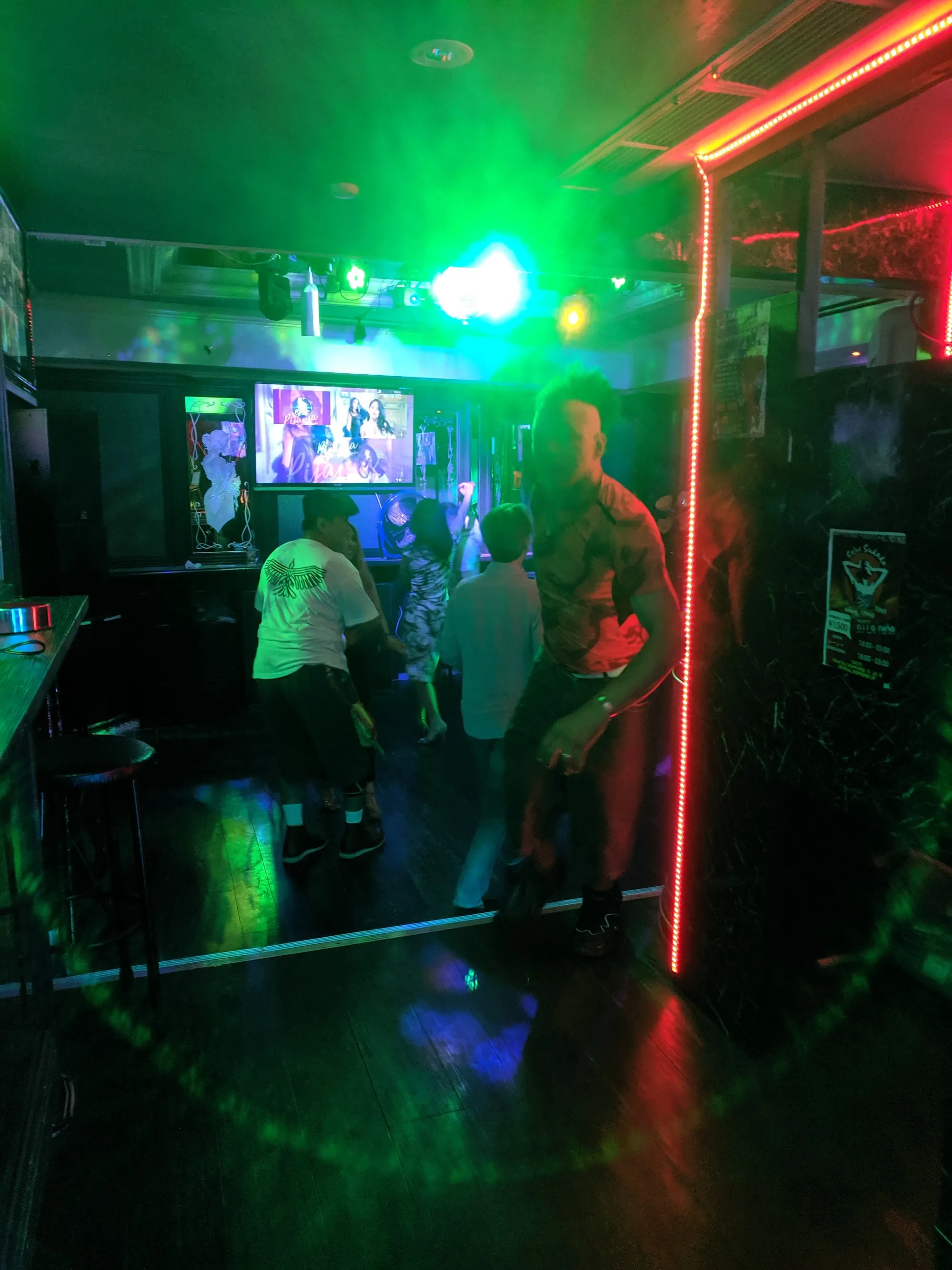 Dark club interior with dancers at Salsa Sudada Tokyo
