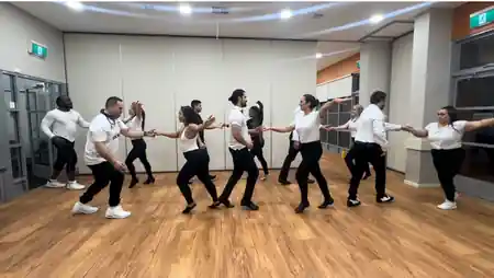 Group of dancers practicing partner work on the wooden floor at La Fiesta Dance Factory in Annandale, Sydney — zouk venue in Sydney