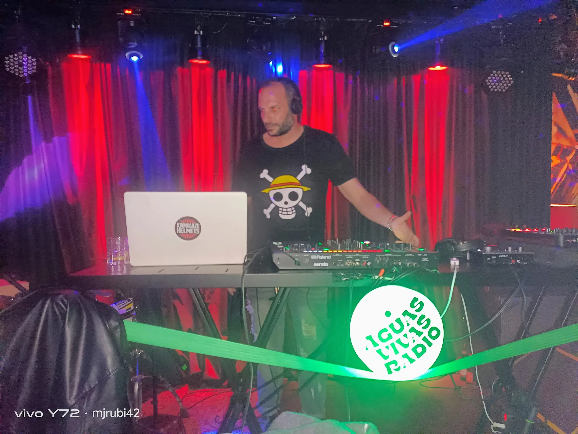 DJ performing on stage with red and blue lighting at Sala Bubaloo, Elche