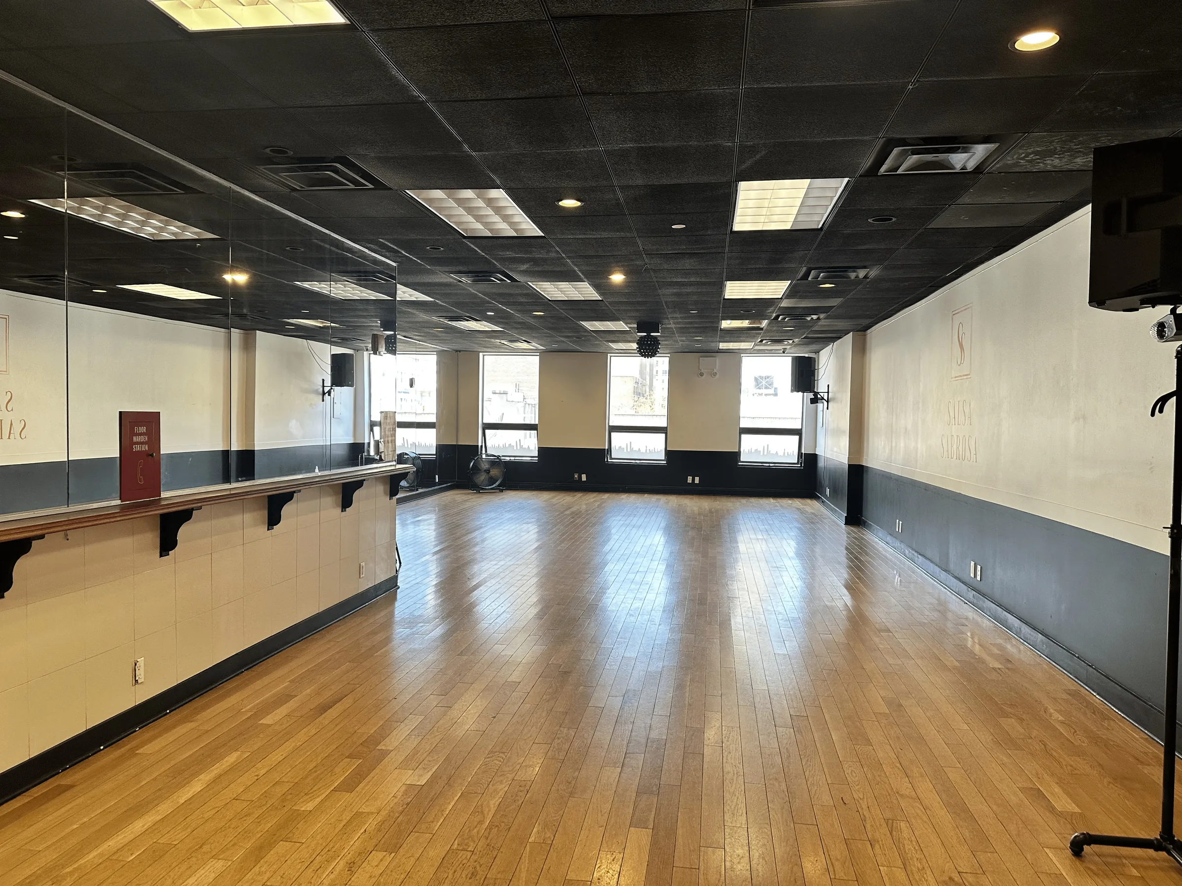 Wooden dance floor and mirrored wall inside Little Dreams Event Space in New York — kizomba venue in New York