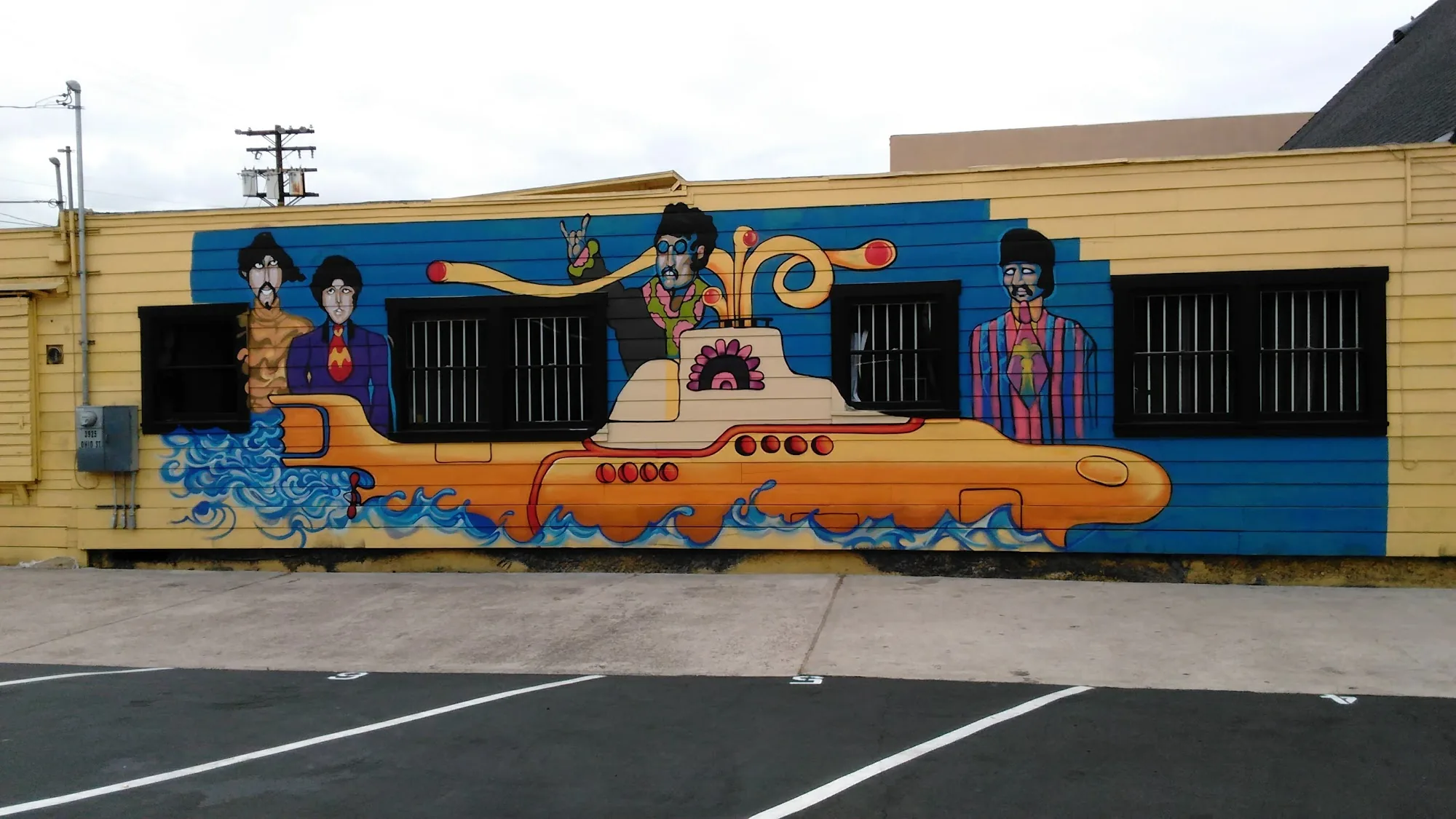 Beatles Yellow Submarine mural on the exterior of Queen Bee's in San Diego