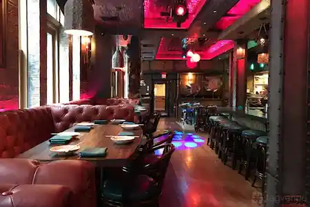 Tiki Rock venue interior with booth seating and ambient lighting — salsa venue in Boston