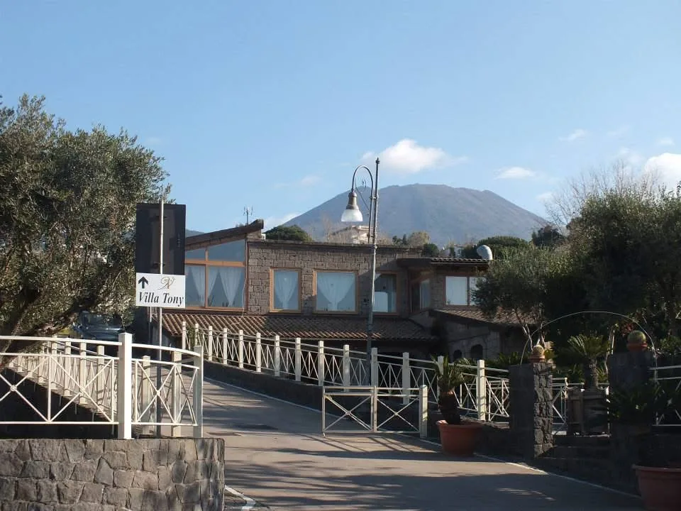 Zeno Complex exterior building with Mount Vesuvius in the background Ercolano