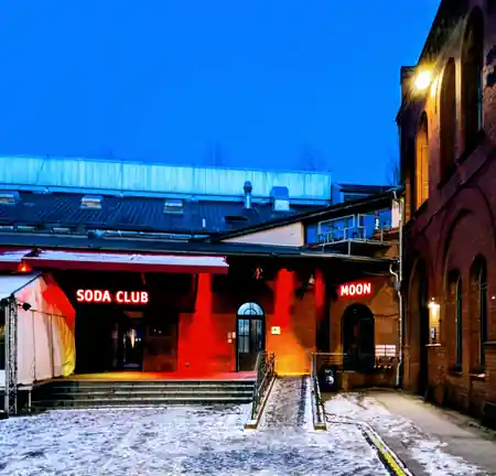 Illuminated SODA CLUB neon signage at the entrance of Soda Social Club Berlin — bachata, kizomba, salsa venue in Berlin