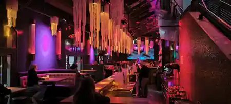 Bar and lounge with chandelier lighting and disco ball at Soda Social Club Berlin — bachata, kizomba, salsa venue in Berlin