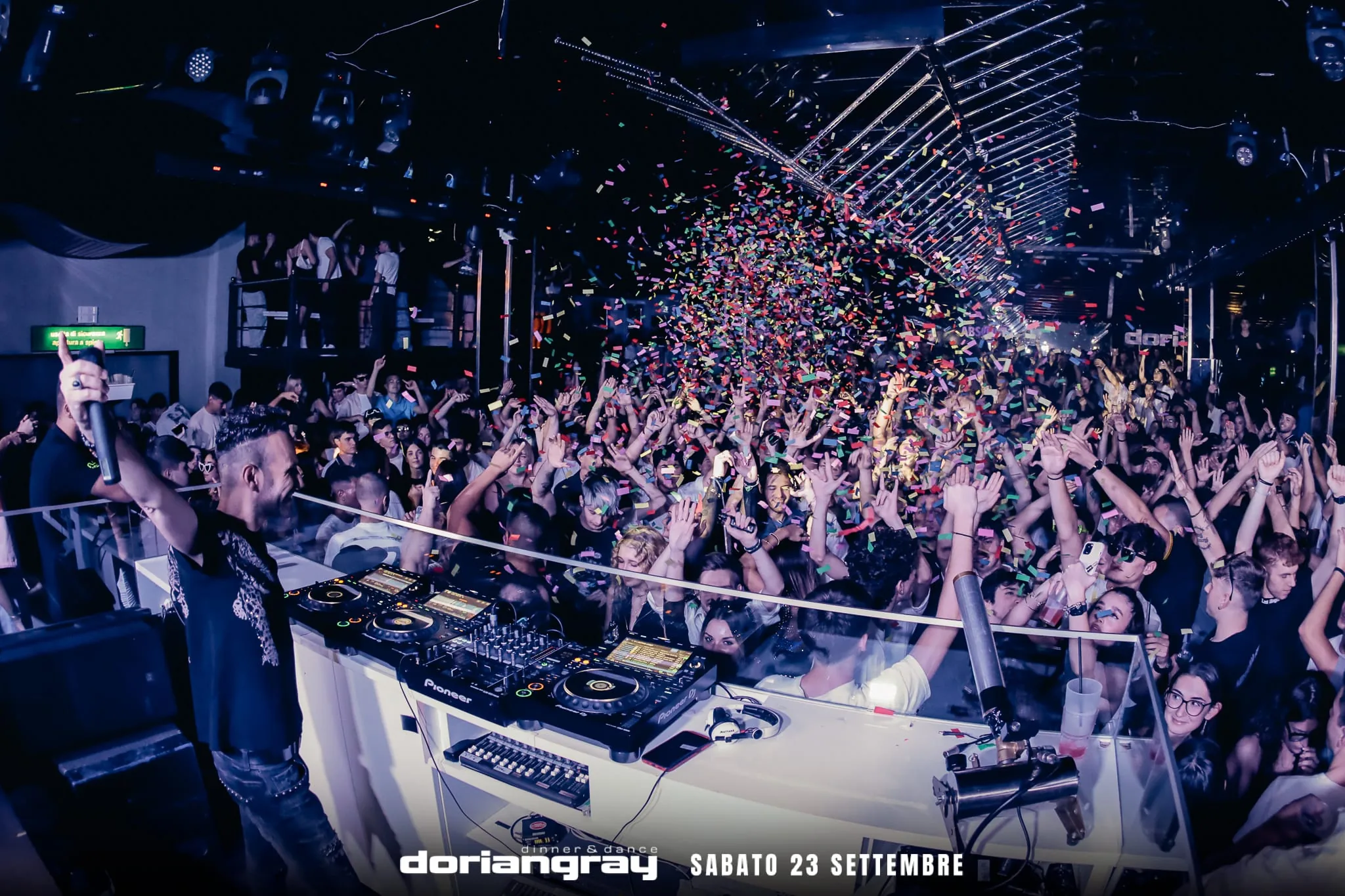 Confetti drop over crowd with DJ at Discoteca Dorian Gray Verona on Saturday night