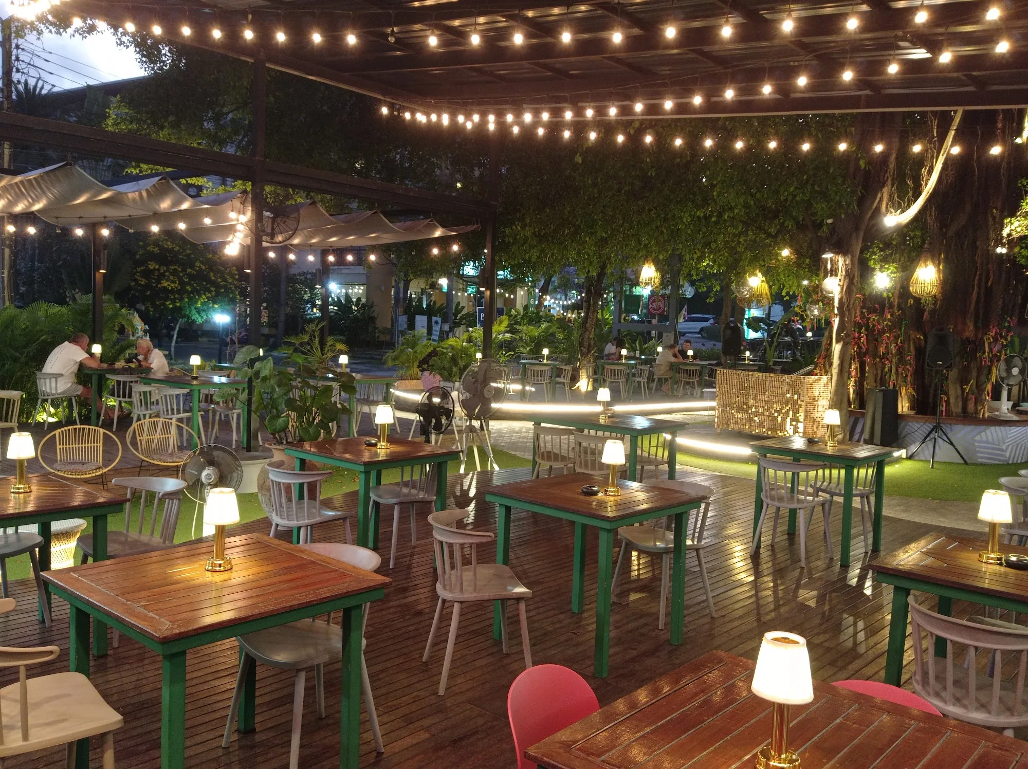 Open-air seating with string lights and live music stage at Banyan Food Market in Koh Samui