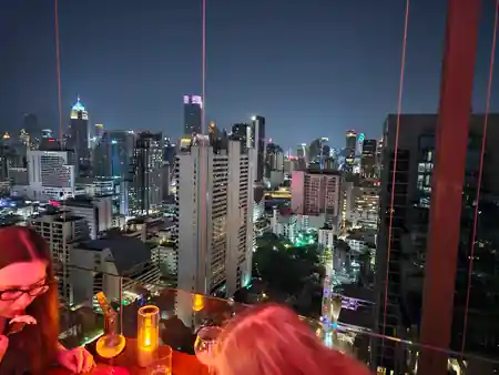 Rooftop bar with panoramic Bangkok night skyline at Above Eleven — salsa venue in Bangkok