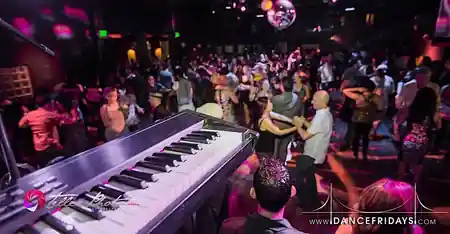 Social dancers enjoying a Latin dance night at Dance Fridays at 345 7th Street in San Francisco with live music stage — zouk venue in San Francisco