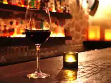 La Santa wine bar interior in San José del Cabo with stone walls and warm lighting — salsa venue in San José del Cabo