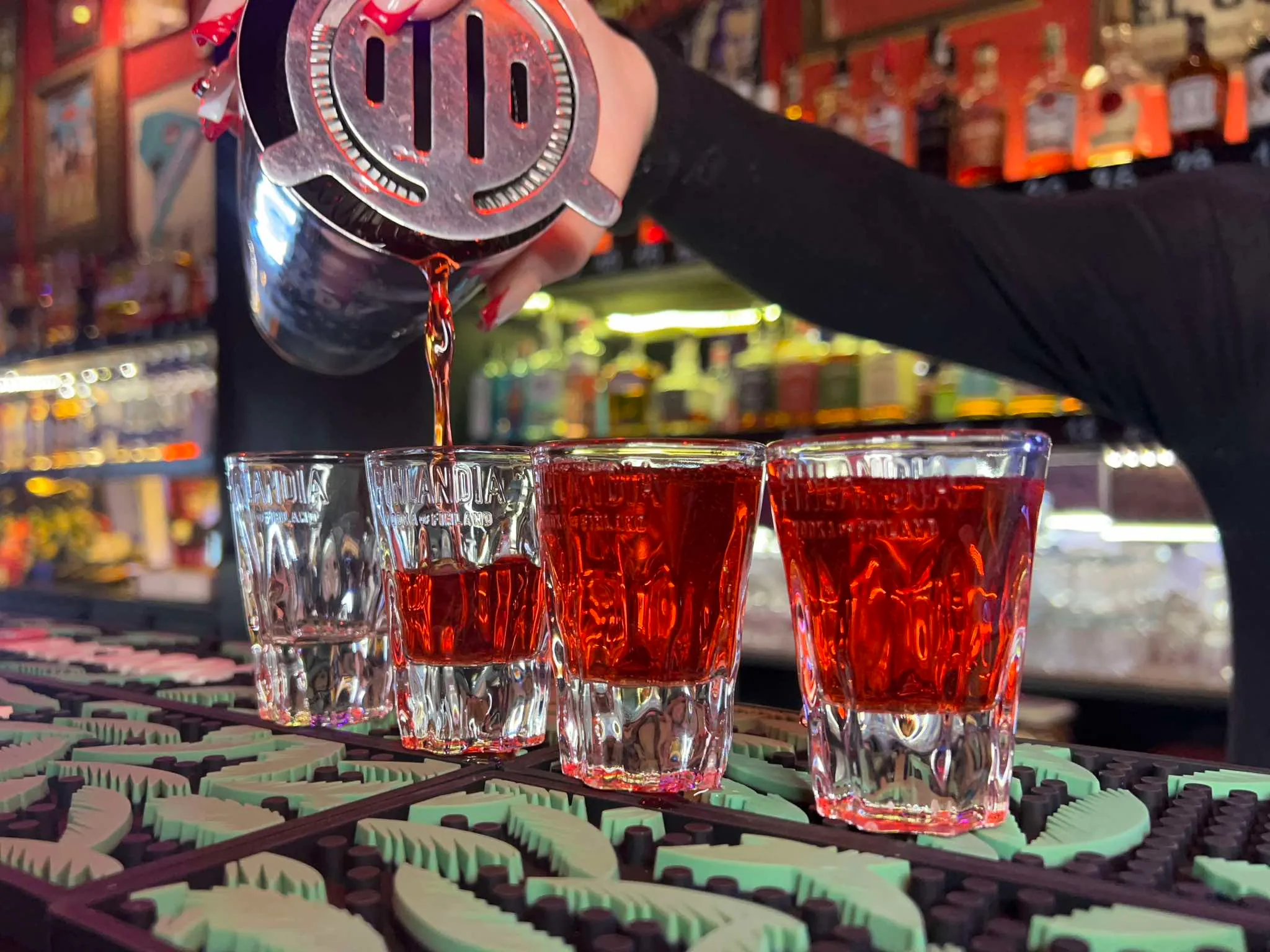 Bartender pouring cocktails at Czarny Kot Klub Wroclaw