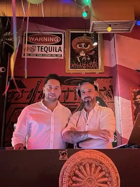 Staff members behind the bar at Czarny Kot Klub Wroclaw with venue decor — salsa venue in Wroclaw