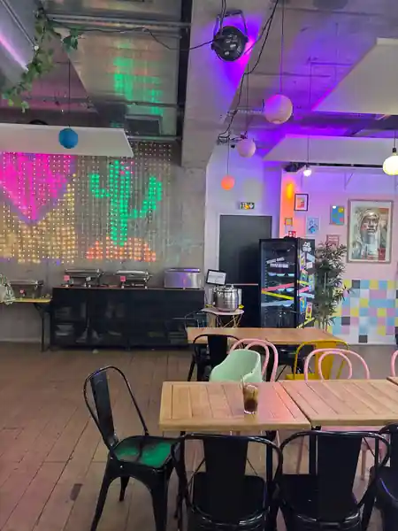 Bar counter with drinks being served under atmospheric club-style lighting — zouk venue in Paris