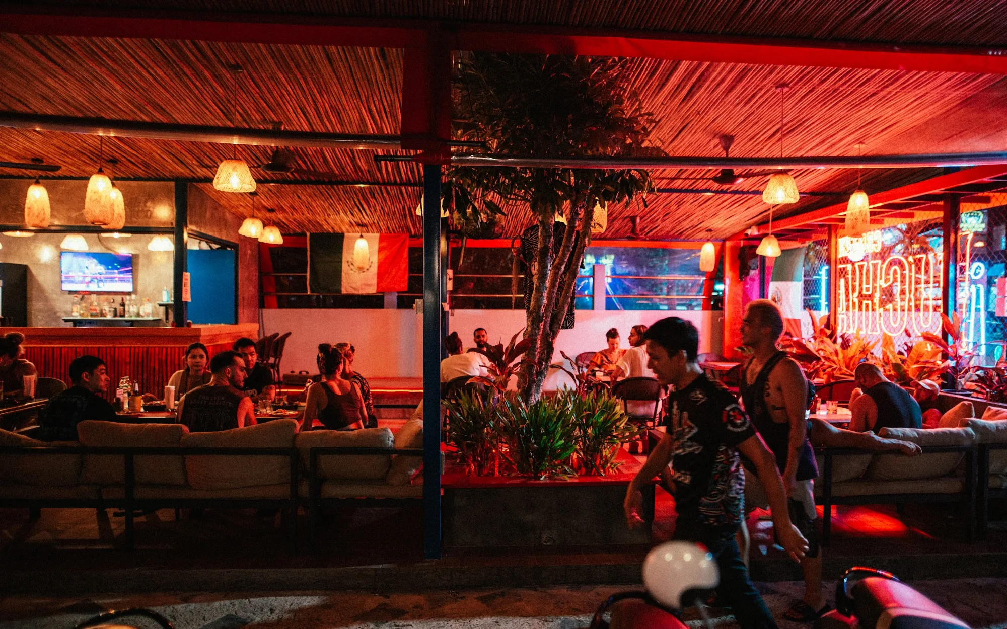 Lively evening crowd under warm lights at Lucha Cantina, Phuket — salsa, bachata, merengue, reggaeton, mix venue in Phuket