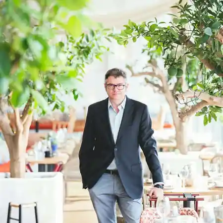 Interior of Veles e Vents venue with citrus trees and dining atmosphere in Valencia — salsa, bachata venue in Valencia