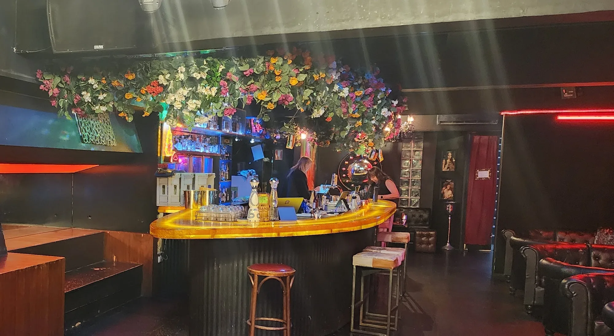 Floral-decorated central bar and lounge interior at Miranda Tequila Bar in Melbourne