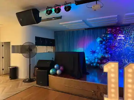 Stage with DJ/PA setup, stage lights and balloon decoration at Little Light Venue Los Angeles — salsa venue in Los Angeles