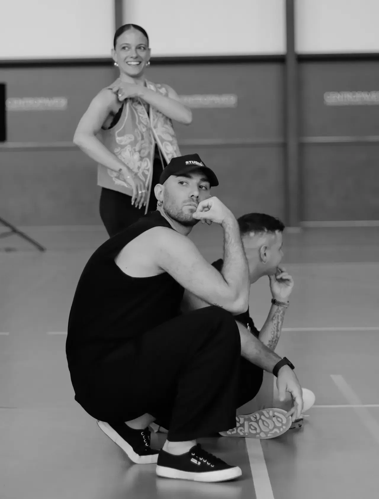 Studio 17 team in the Milan dance studio interior with branded cap visible