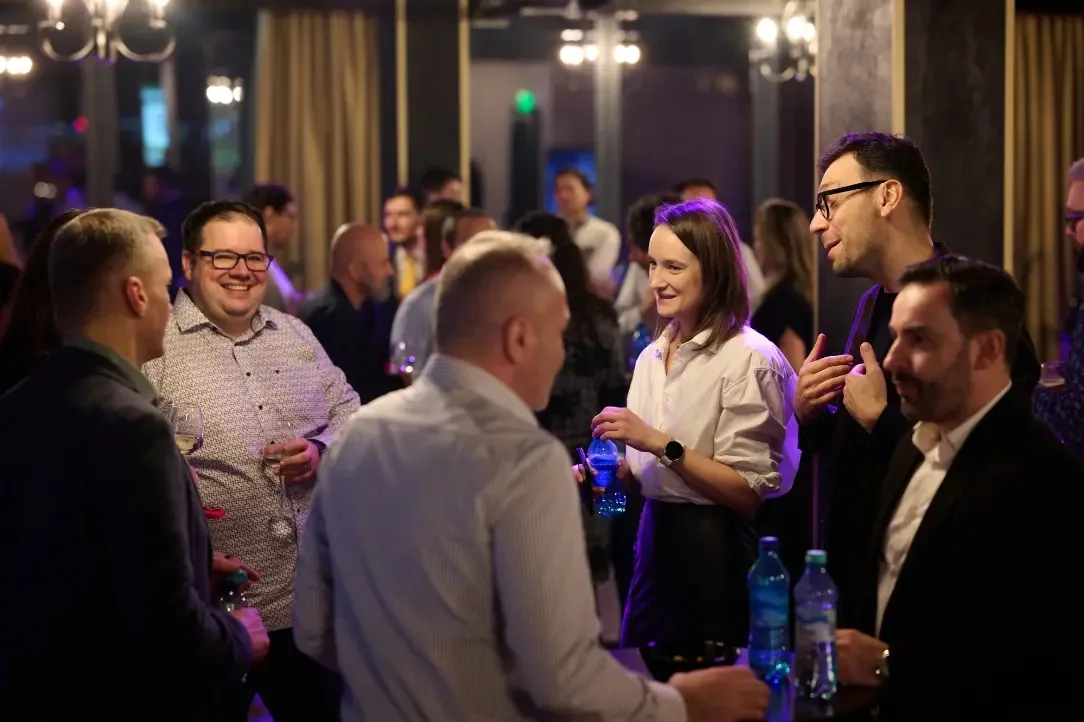 Guests mingling under purple lights at Mille 18 Events social night in Bucharest — salsa, bachata, kizomba venue in Bucharest