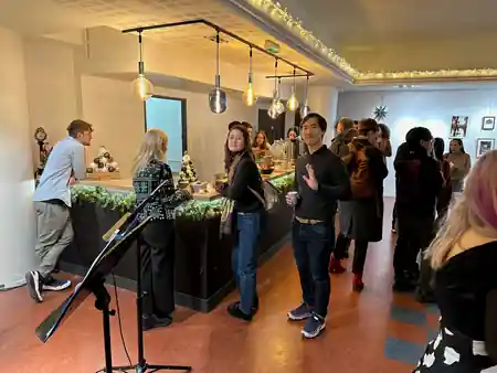 Social gathering at the bar inside Paris Épicentre with warm festive lighting — bachata venue in Paris