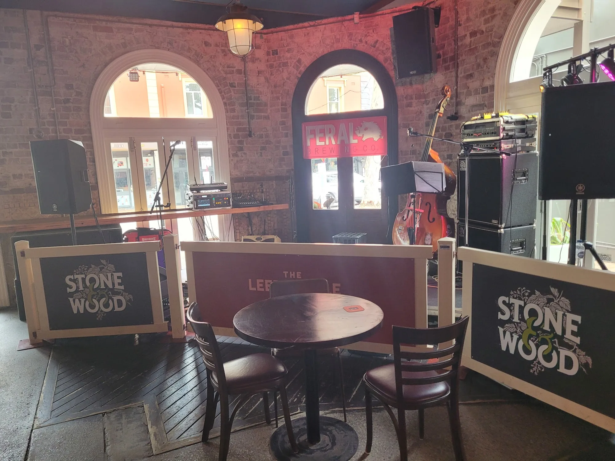 Live music stage setup inside The Leederville Hotel with Stone and Wood beer branding and instruments ready