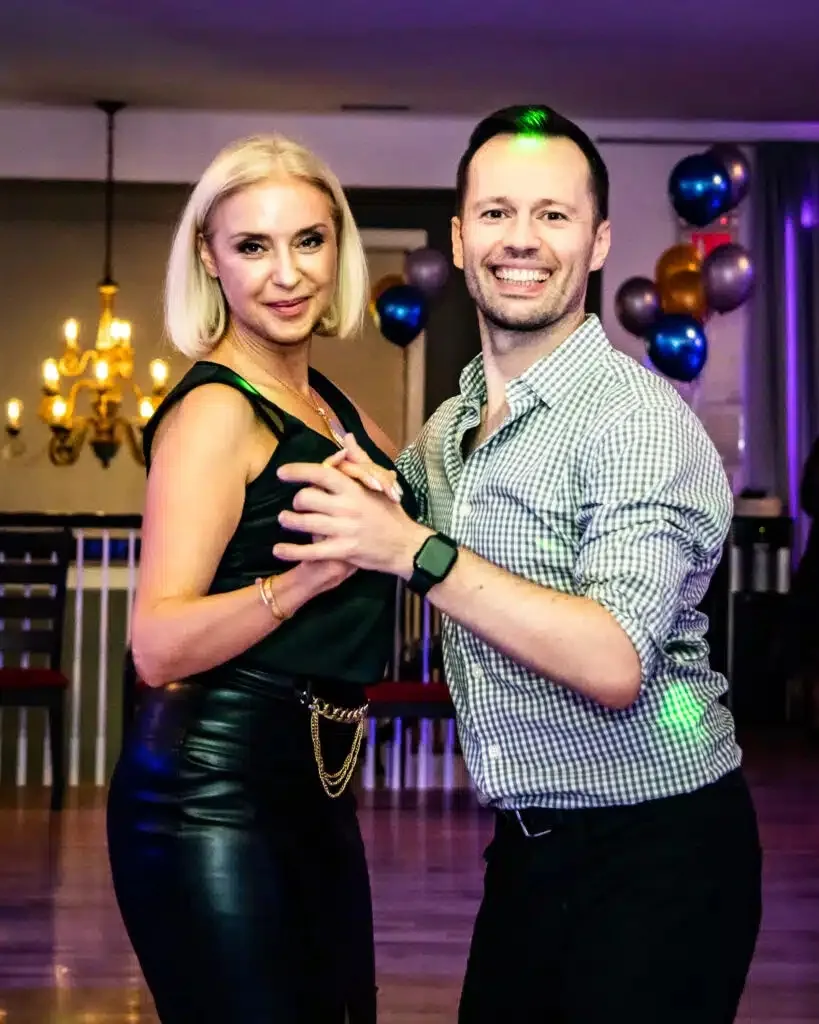 Couple in partner dance hold on the floor at Danznik Studios NYC in New York