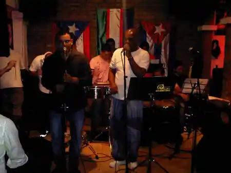 Live salsa band performing at Zaperoco bar in Cali, Colombia
