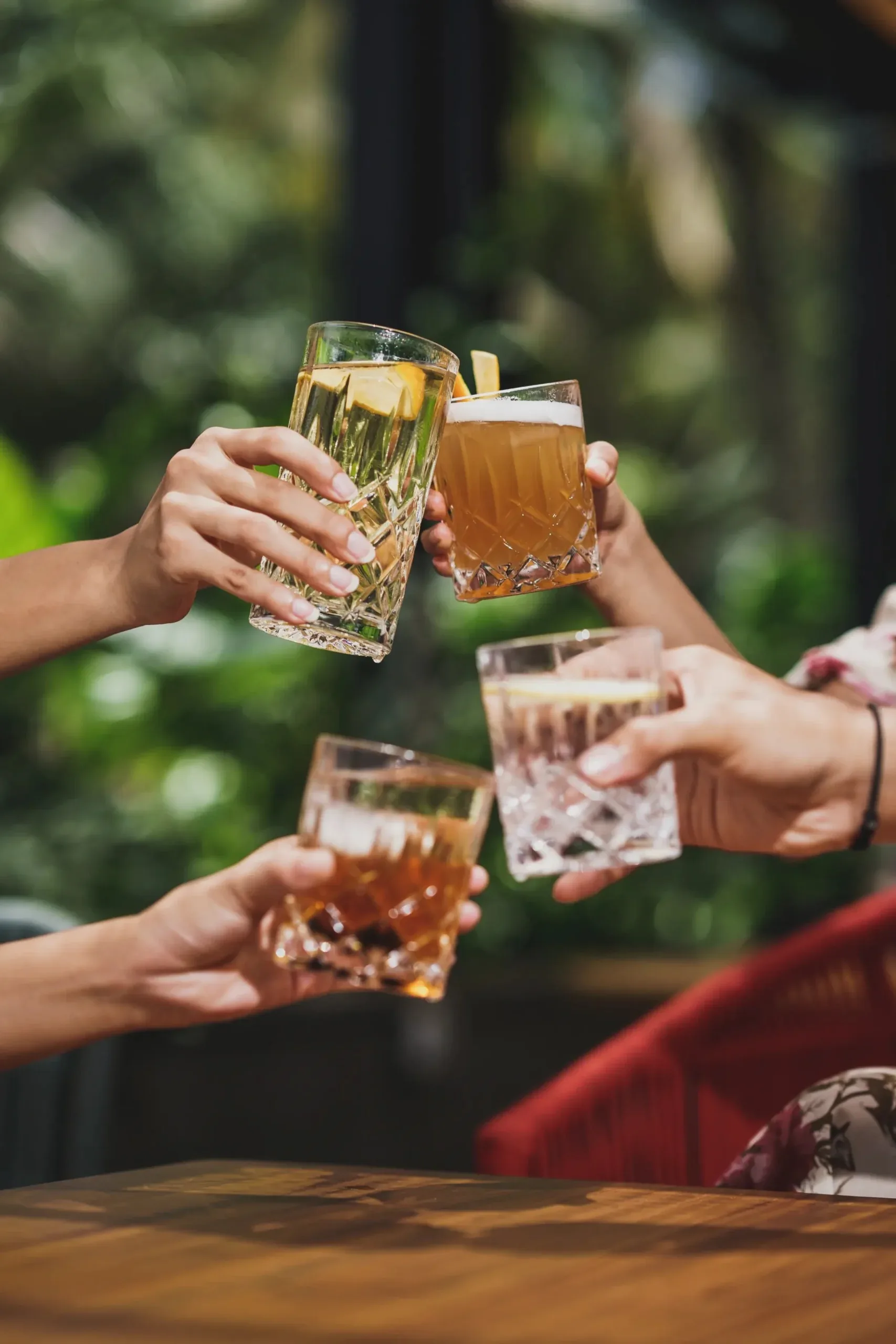 Guests toasting cocktails at Juggan Sky lounge terrace in Bali — zouk venue in Bali