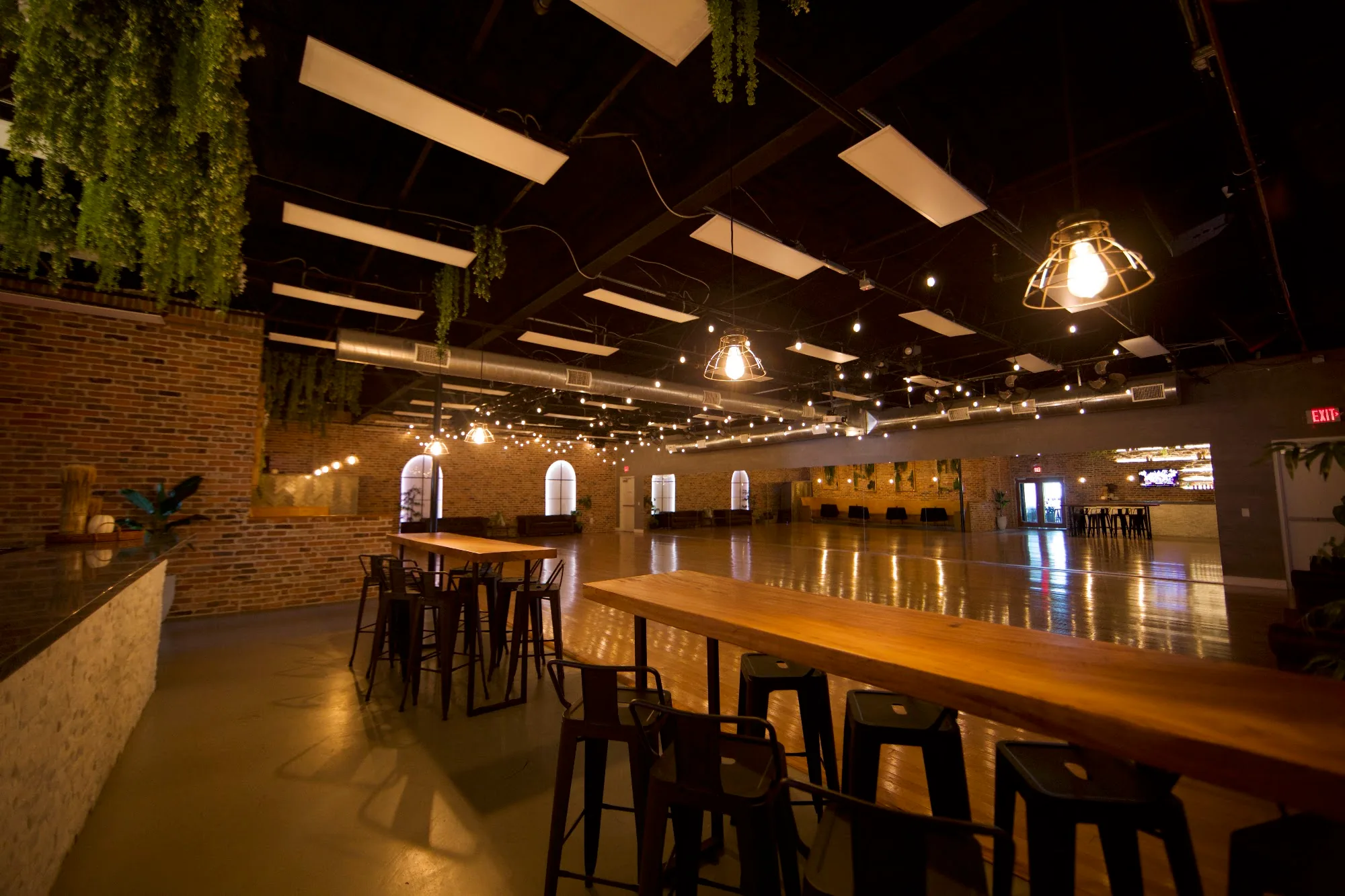 Bar and high-top tables beside the dance floor at The Palladium, Houston