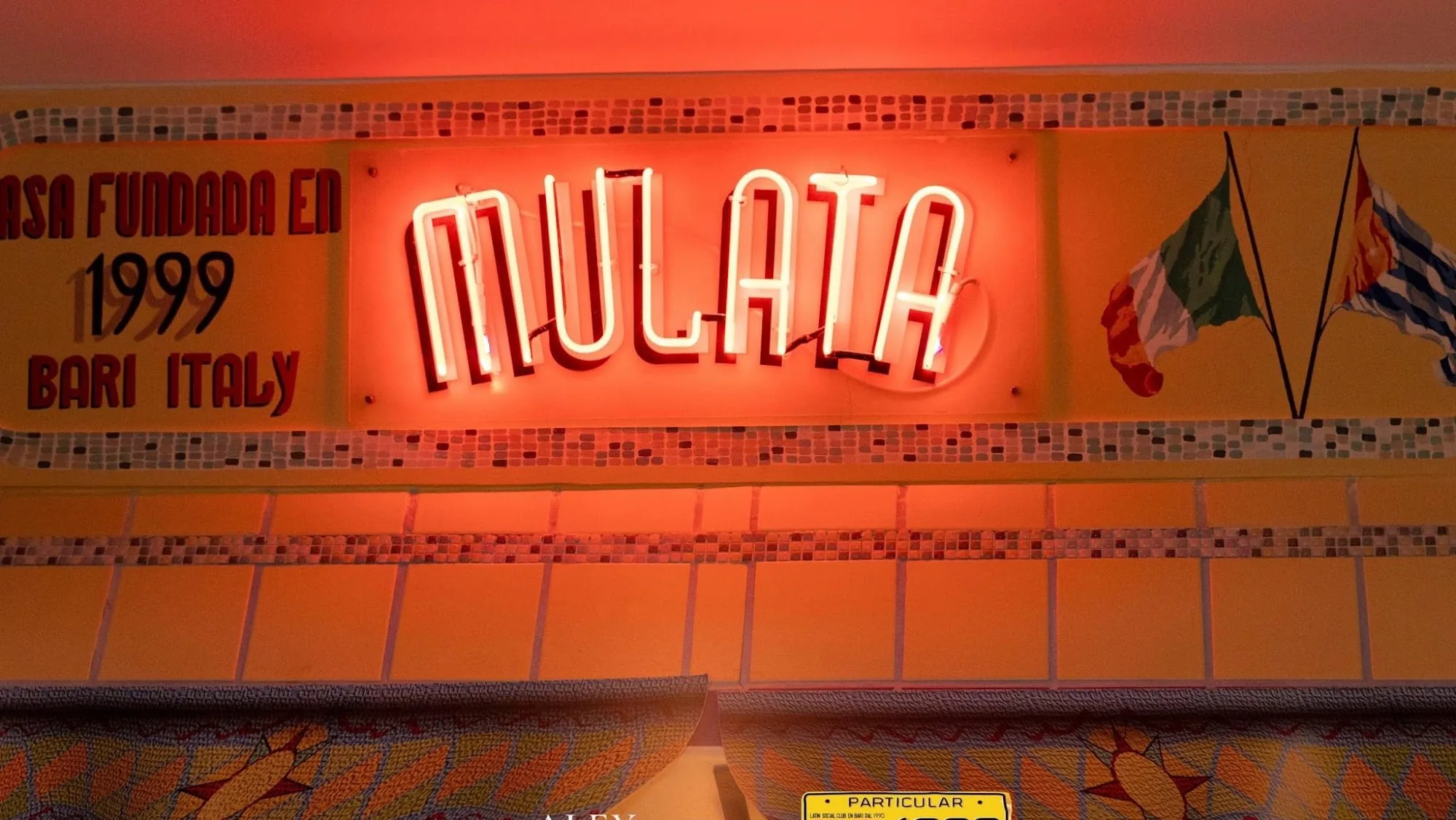 Mulata Latin Social Club Bari neon sign inside the venue interior