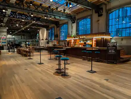 Moods Zurich Schiffbau venue interior with large wooden dance floor and bar — bachata, salsa venue in Zurich