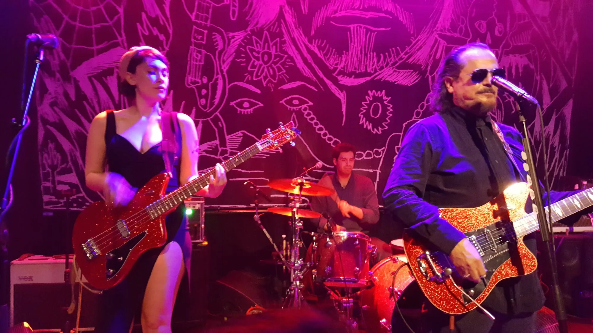 Live rock band on stage at Moods Zurich with vivid pink stage lighting