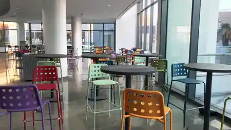 The Source OC building with colorful architecture and dining area in Buena Park — zouk venue in Buena Park