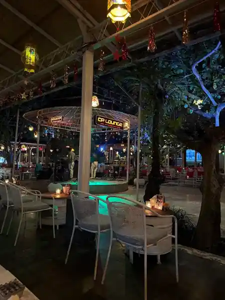 CP Lounge Bali outdoor stage and dance floor area with colorful lanterns, Christmas decorations, and atmospheric evening lighting — salsa, bachata venue in Bali