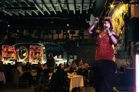 Live performer on stage with audience at Atolye Venue & Bar in New York — salsa, bachata venue in New York