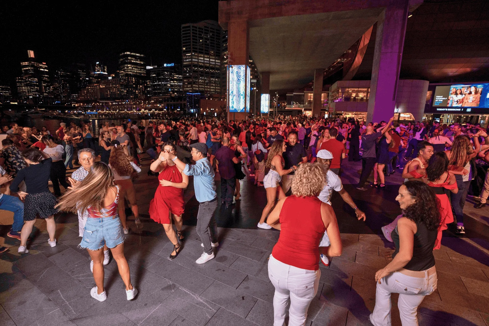 Latin Nights social dancers filling the outdoor floor at Palm Grove, Darling Harbour Sydney