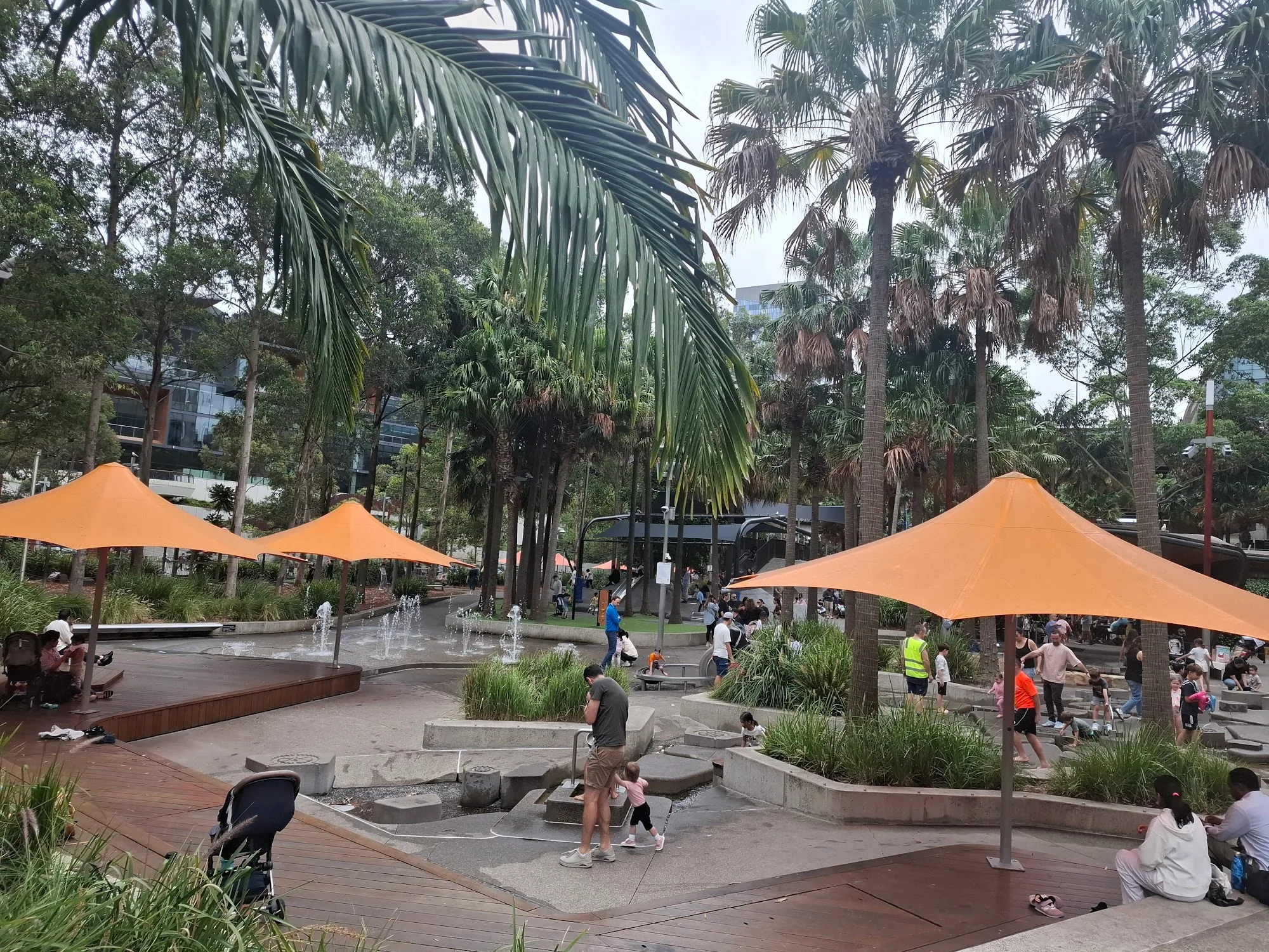 Palm Grove's iconic orange shade sails and palm trees at Darling Harbour Sydney, the Latin Nights venue setting