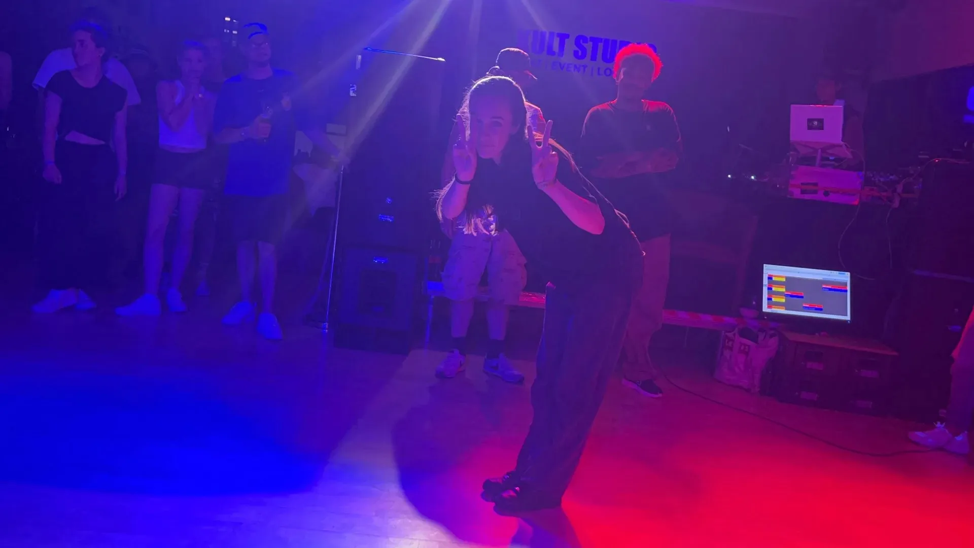 Dancer performing on the dance floor with crowd watching at Kult Studio Munich