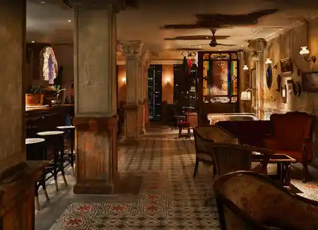 Vintage interior bar lounge with stained glass and antique furniture at Havana Social Bangkok — salsa, bachata venue in Bangkok