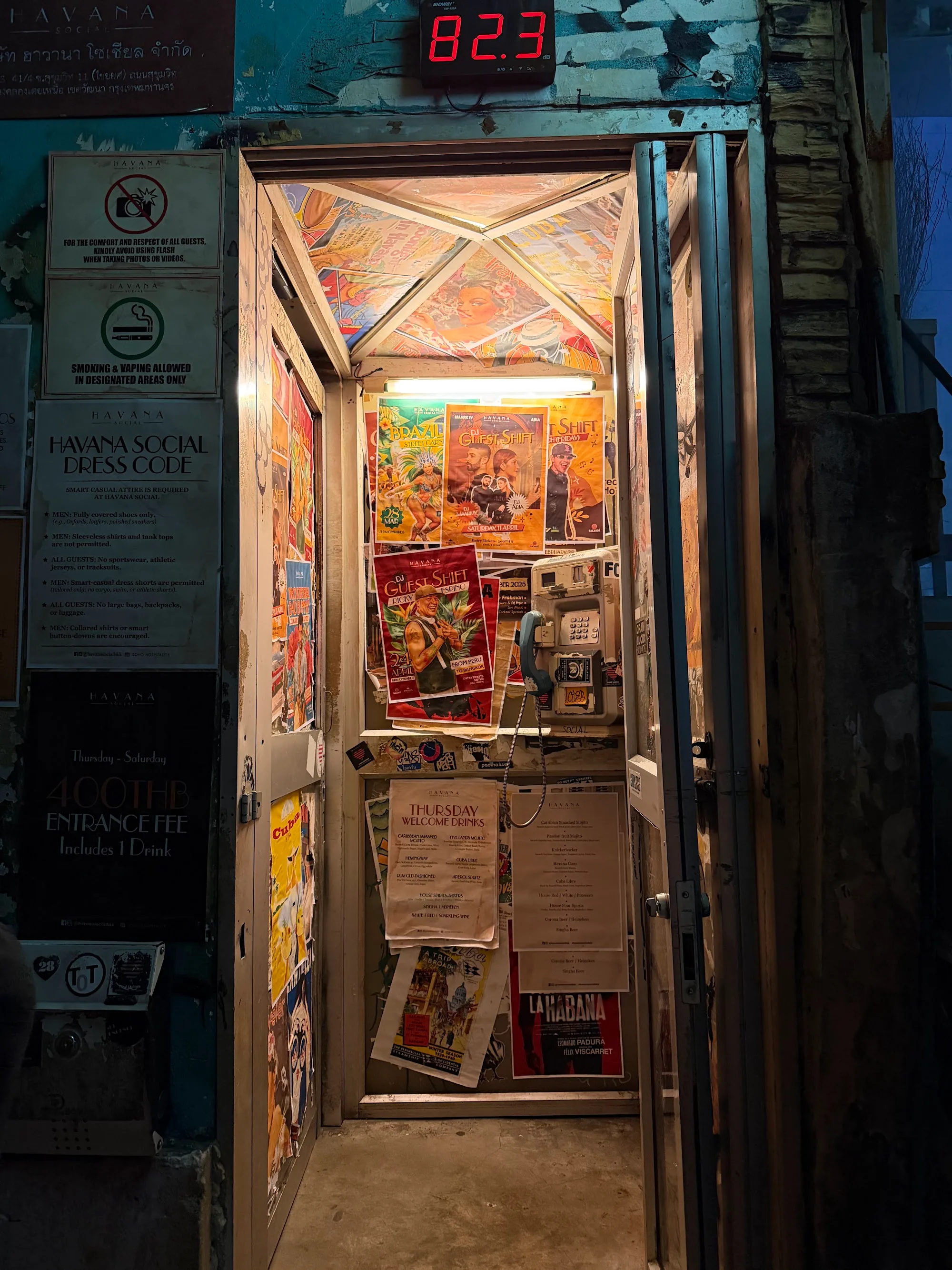 Entrance hallway with posters and dress code signs at Havana Social Bangkok