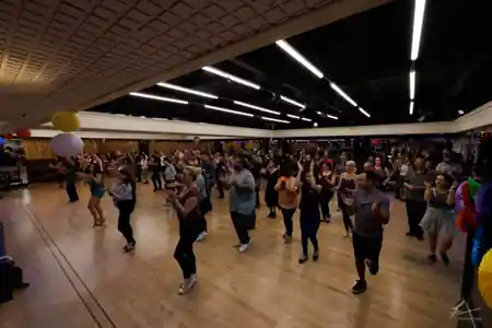 Atomic Ballroom dance floor with colorful stage lighting and dancers in Irvine, kizomba venue in Irvine